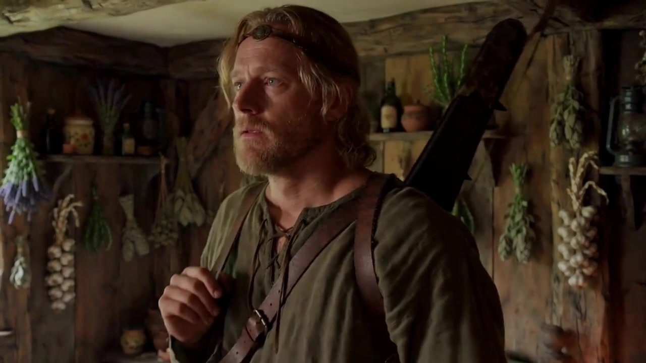 Edgar, bow slung over his shoulder, ready to leave his cottage